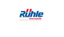 Logo von Rühle Brennstoffe, blauer Text mit roten Akzenten auf weißem Hintergrund.