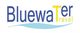 Logo mit der Aufschrift "Bluewater Travel" in Blau und Gelb auf weißem Hintergrund, wellenförmig.