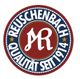 Emblem mit Schriftzug "Reuschenbach Qualität seit 1914" in Blau und Rot.