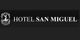 Logotipo del Hotel San Miguel en fondo negro con letras blancas y un emblema circular a la izquierda.