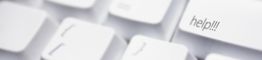 Weiße Tastatur mit großer "help!!!"-Taste in Nahaufnahme.