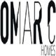 Text "OMAR C HOMES" in bold, angular font on a white background.