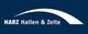 Logo: Auf dunkelblauem Hintergrund steht "HARZ Hallen & Zelte" neben einem weißen Bogen.