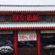 Snowy restaurant exterior with "Tokyo & Beijing" sign and 30% off grand opening banner.