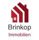Logo von Brinkop Immobilien, rote Häuser-Ikone und Schriftzug auf weißem Hintergrund.