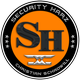 Logo "Security Harz", schwarzer Kreis, oranger Hintergrund, SH in der Mitte.