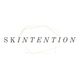 Text "SKINTENTION" over a faceted geometric shape on a white background.