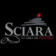 Logo di Sciara, "La Terra del Pistacchio", con pistacchi stilizzati e vulcano rosso su sfondo nero.