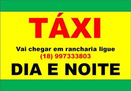 Placa de táxi com telefone para contato em Rancharia, disponível dia e noite.