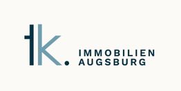 Logo der Firma "tk Immobilien Augsburg" mit modernem Schriftzug in Blau und Grau.