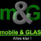 Schwarzes Logo mit grüner und grauer Schrift: "m&G mobile & GLAS Alles klar!"