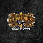 Logotipo "Crossroads" em fundo escuro, com texto "Since 1997" abaixo.