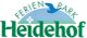 Logo des Ferienparks Heidehof mit Vogel und Hügel.