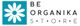 Logo de Be Organika Store con una flor blanca sobre fondo turquesa.
