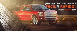 Camioneta roja destacada con texto promocionando compra rápida de llantas en un sitio web.