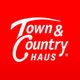 Rotes Logo mit weißem Text: "Town & Country Haus".
