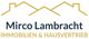 Logo von Mirco Lambrecht Immobilien & Hausvertrieb mit Hausdach-Symbolik.