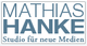 Textlogo: "Mathias Hanke – Studio für neue Medien" in blauer Schrift auf weißem Hintergrund.