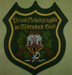 Wappen der Privilegierten Schützengilde zu Wittstock von 1560 mit Burgmotiv und Schriftzug.