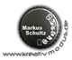 Kameramodus-Wahlrad mit Text "Markus Schultz" und Webseite www.kreativmodus.de in Weiß auf Schwarz.