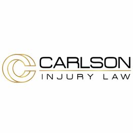 Logo of Carlson Injury Law with a stylized "C" in gold and black text.