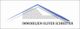 Logo mit Ziegeldach und Mauerwerk, darunter der Text "IMMOBILIEN OLIVER SCHREITER".