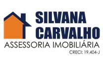 Logotipo da Silvana Carvalho, uma casa laranja e preta com o texto: "Assessoria Imobiliária".