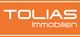 Orangefarbenes Logo mit weißem Text "TOLIAS Immobilien".