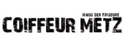 Schwarz-weißer Text: "Coiffeur Metz - Haus der Friseure".