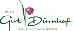Logo des Hotels Gut Dürnhof, natürliche Gastlichkeit, mit Blume in lila und grüner Schrift.