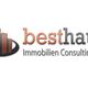Logo mit drei orange Hochhäusern, daneben Text: besthaus Immobilien Consulting e.K.