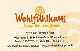 Visitenkarte des Wohlfühlhauses mit Kontaktinformationen und Website.