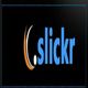 Logo with the text ".slickr" on a black background.