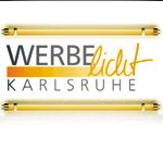 Logo mit Text "Werbelicht Karlsruhe", umgeben von zwei goldenen Leuchtstoffröhren.