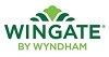 Logo of Wingate by Wyndham with green stylized design above the text.