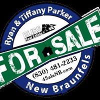 Real estate sign: "For Sale" by Ryan & Tiffany Parker, New Braunfels, with contact info.