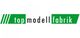 Grünes Logo mit Schriftzug "top modell fabrik" in Weiß und Schwarz auf grünem Hintergrund.
