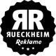 Schwarzes Logo mit "RR", "RUECKHEIM" und "Reklame", umgeben von einem gezackten Kreis.