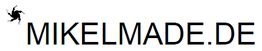Schwarzer Text "MIKELMADE.DE" mit kleinem springenden Mann im linken oberen Eck.
