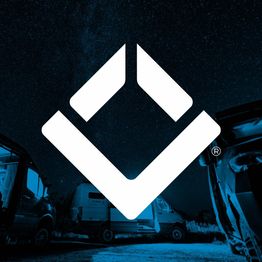 Geometric logo with vans at night under a starry sky.