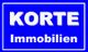 Blaues Logo mit weißem Text: "KORTE Immobilien".