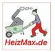 Mann schiebt Schubkarre mit Heizgerät, darunter steht "HeizMax.de".
