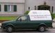 Grüner Lieferwagen mit Firmenwerbung "langenstroeer-elektro.de" und Telefonnummer darauf.