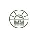 Logo of Banzai Adventures with a bird and sun design in green.