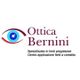 Logo Ottica Bernini con un occhio stilizzato e testo su lenti progressive e a contatto.