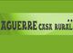 Imagen de un letrero verde que dice "Aguerre Casa Rural" con dos estrellas.