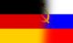Die Flaggen Deutschlands und Russlands mit sowjetischem Symbol überlappen sich in der Mitte.
