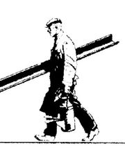 Ein Mann trägt zwei lange Bretter und einen Eimer, während er nach rechts geht.