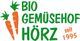 Zwei Karotten und der Text "Bio Gemüsehof Hörz seit 1995" in grün und orange.