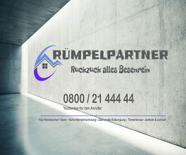 Rumpelpartner-Werbung an Betonwand mit Kontaktinfo und Slogan "Ruckzuck alles Besenrein".